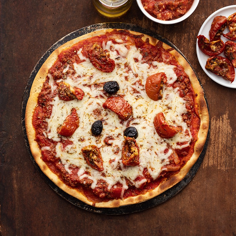 Photo d'une pizza italienne faite par la Tour de Pise